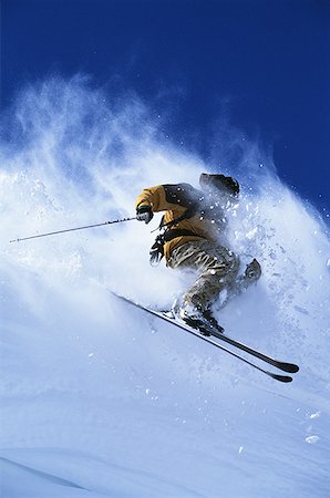 simsearch:640-01362181,k - Downhill skier skiing on mountain Foto de stock - Sin royalties Premium, Código: 640-01359973