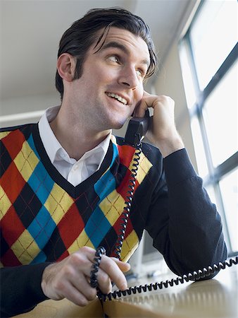 simsearch:640-01354541,k - Close-up of a businessman talking on the telephone Fotografie stock - Premium Royalty-Free, Codice: 640-01359983