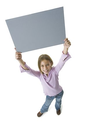 simsearch:640-01360910,k - High angle view of a girl holding a blank sign Stock Photo - Premium Royalty-Free, Code: 640-01350037