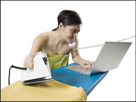 simsearch:640-01350045,k - Young woman multi-tasking Foto de stock - Royalty Free Premium, Número: 640-01350045