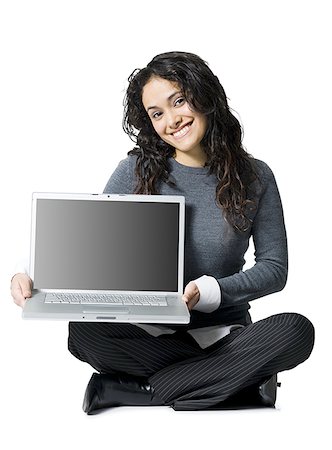 simsearch:640-02773811,k - Woman sitting cross legged with laptop Stock Photo - Premium Royalty-Free, Code: 640-01350050
