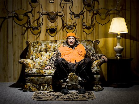 simsearch:640-02771097,k - Man on sofa with antlers Stock Photo - Premium Royalty-Free, Code: 640-01350156