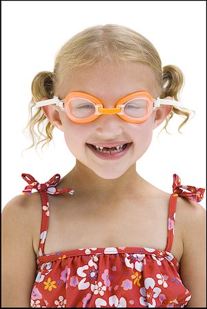 swim goggles - Young sisters on vacation playing with a beach ball Stock Photo - Premium Royalty-Free, Code: 640-01350163