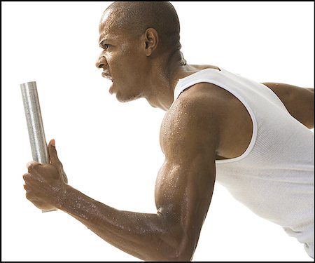 Profile of a young man running a relay race Foto de stock - Sin royalties Premium, Código: 640-01350188