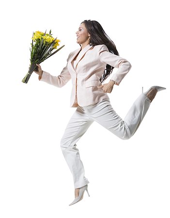simsearch:640-01354318,k - Young woman jumping in mid-air and holding a bouquet of flowers Foto de stock - Sin royalties Premium, Código: 640-01350204
