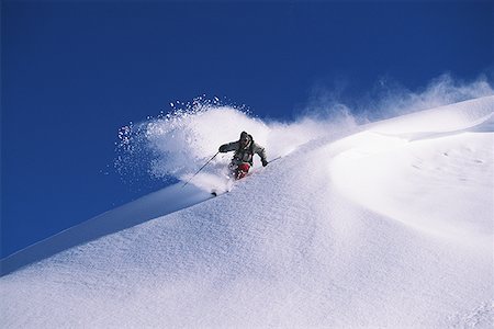 simsearch:640-01362181,k - Downhill skier skiing on mountain Foto de stock - Sin royalties Premium, Código: 640-01350275