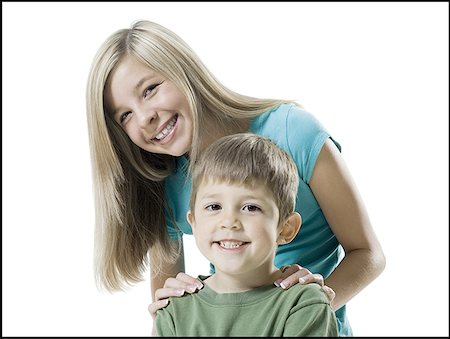 simsearch:640-01360912,k - Portrait of a boy and his sister smiling Fotografie stock - Premium Royalty-Free, Codice: 640-01350270