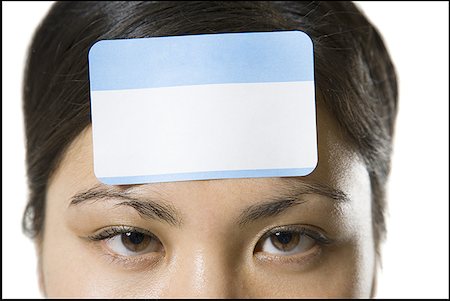simsearch:700-00161547,k - Portrait of a young woman with a blank name tag on her forehead Foto de stock - Sin royalties Premium, Código: 640-01350349