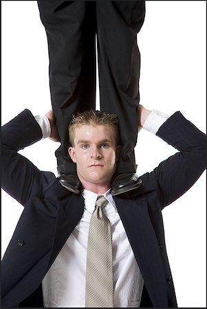 Businessman supporting colleague on shoulders Stock Photo - Premium Royalty-Free, Code: 640-01350436