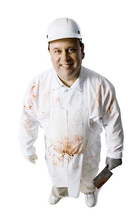 simsearch:640-02772428,k - Butcher standing with knife Foto de stock - Sin royalties Premium, Código: 640-01350439