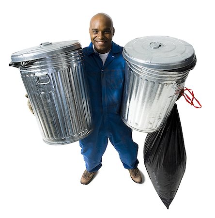 Garbage man with trash cans Stock Photo - Premium Royalty-Free, Code: 640-01350510