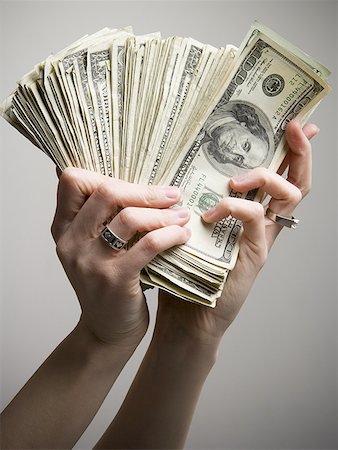 fanned out - Close-up of a person's hand holding American paper currency Stock Photo - Premium Royalty-Free, Code: 640-01350550