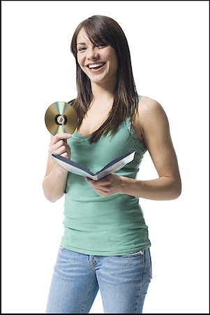 dvd silhouette - Young woman holding a DVD Stock Photo - Premium Royalty-Free, Code: 640-01350624