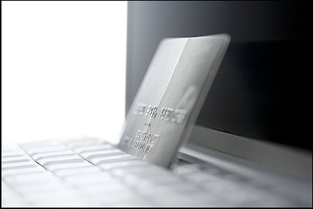 simsearch:640-01362673,k - Close-up of a laptop and a credit card Stock Photo - Premium Royalty-Free, Code: 640-01350637