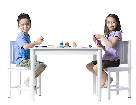 simsearch:640-02772735,k - Boy and girl sitting at table doing crafts Stock Photo - Premium Royalty-Free, Code: 640-01350667