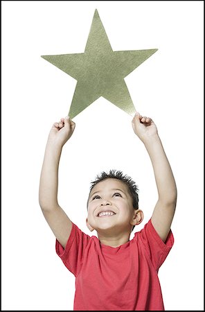 simsearch:640-01364825,k - Close-up of a boy holding a star Foto de stock - Sin royalties Premium, Código: 640-01350671