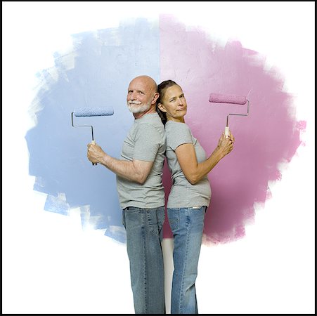simsearch:640-01352416,k - Portrait of a senior couple holding paint rollers Foto de stock - Sin royalties Premium, Código: 640-01350733