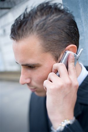 simsearch:640-02950930,k - Close-up of a businessman talking on a cell phone Stock Photo - Premium Royalty-Free, Code: 640-01350742