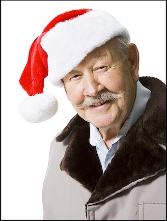 simsearch:640-01358490,k - Older man wearing Santa hat Stock Photo - Premium Royalty-Free, Code: 640-01350818