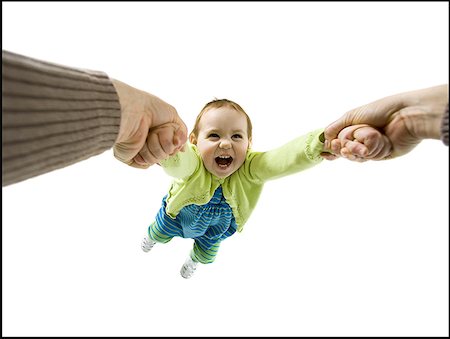 silhouette of new born baby - Mother swinging baby girl Stock Photo - Premium Royalty-Free, Code: 640-01350872