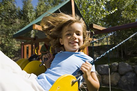 fluttuazione - Portrait of a girl sitting on a swing Fotografie stock - Premium Royalty-Free, Codice: 640-01350873