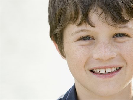 Portrait of a boy smiling Stock Photo - Premium Royalty-Free, Code: 640-01351017