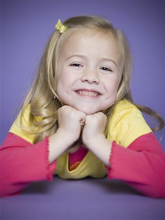 Portrait of a girl smiling Stock Photo - Premium Royalty-Free, Code: 640-01351195