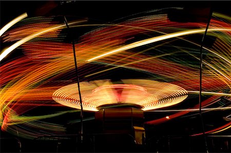 Low angle view of a ferris wheel lit up at night Stock Photo - Premium Royalty-Free, Code: 640-01351315