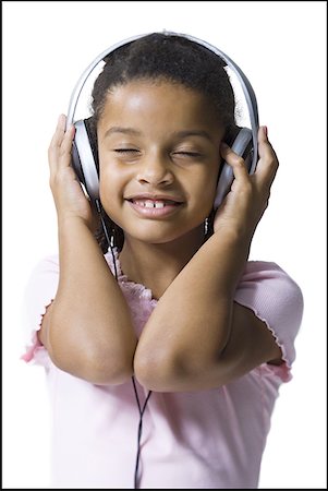 simsearch:640-01362740,k - Close-up of a girl listening to music wearing headphones Foto de stock - Sin royalties Premium, Código: 640-01351343