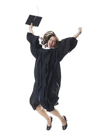 student jumping to school - Female student celebrating graduation Stock Photo - Premium Royalty-Free, Code: 640-01351485