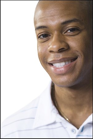 simsearch:640-01350948,k - Portrait of a young man smiling Stock Photo - Premium Royalty-Free, Code: 640-01351497