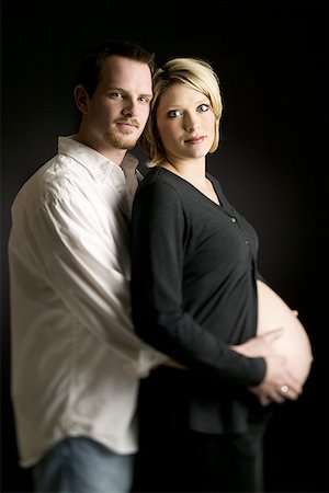 Side profile of a mature man hugging a pregnant woman Stock Photo - Premium Royalty-Free, Code: 640-01351590