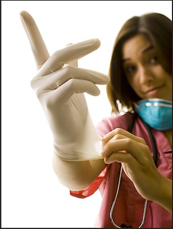 Femme médecin dans scrubs roses avec des gants de caoutchouc Photographie de stock - Premium Libres de Droits, Code: 640-01351628