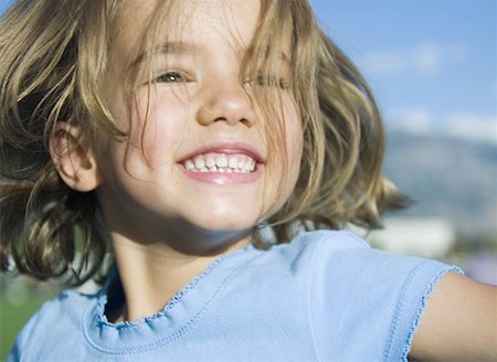 fun kid 10 - Close-up of a girl smiling Stock Photo - Premium Royalty-Free, Code: 640-01351655