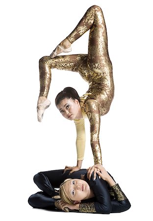 strong female acrobats - Female contortionist duo performing Stock Photo - Premium Royalty-Free, Code: 640-01351656