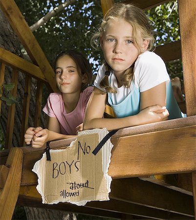 Portrait of two girls on a tree house Stock Photo - Premium Royalty-Free, Code: 640-01351680