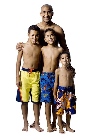 preteen boy happy white background - Father posing with three sons Stock Photo - Premium Royalty-Free, Code: 640-01351698