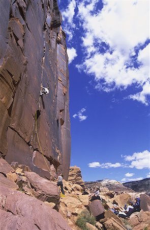 simsearch:640-01349855,k - Low angle view of a person rock climbing Foto de stock - Sin royalties Premium, Código: 640-01351747