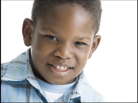 Portrait of a boy smiling Stock Photo - Premium Royalty-Free, Code: 640-01351790