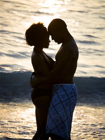 Couple embracing on beach Stock Photo - Premium Royalty-Free, Code: 640-01351816