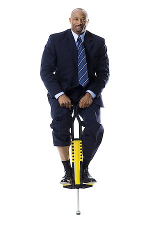 pogo stick - Homme d'affaires sur un pogo stick Photographie de stock - Premium Libres de Droits, Code: 640-01351938