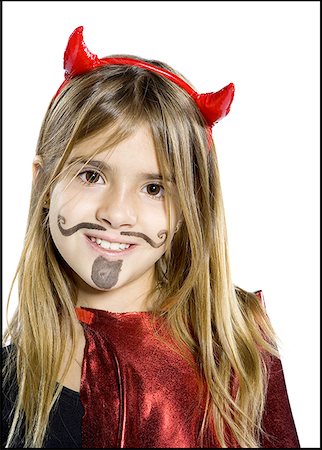 simsearch:640-01360385,k - Close-up of a girl dressed as a devil Stock Photo - Premium Royalty-Free, Code: 640-01351985