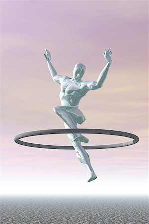 Low angle view of a metallic man jumping through a ring Stock Photo - Premium Royalty-Free, Code: 640-01352072