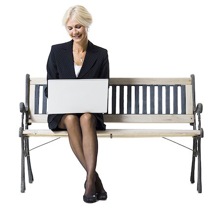 simsearch:640-02771838,k - Businesswoman sitting on bench with laptop Stock Photo - Premium Royalty-Free, Code: 640-01352150