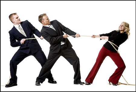 Business people engaged in a tug of war contest Stock Photo - Premium Royalty-Free, Code: 640-01352174