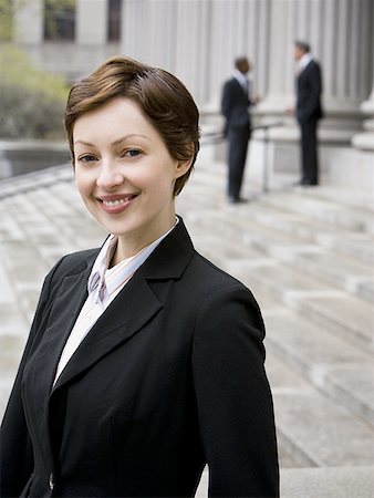 female lawyer portrait - Portrait of a female lawyer smiling Stock Photo - Premium Royalty-Free, Code: 640-01352215