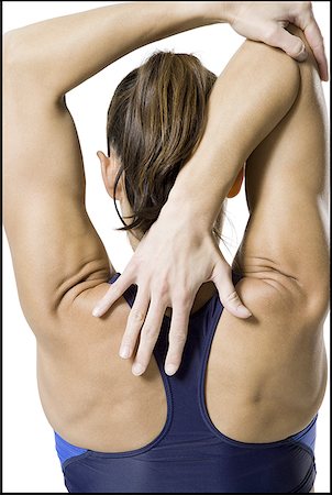 simsearch:640-01355937,k - Rear view of a woman stretching her arms Foto de stock - Sin royalties Premium, Código: 640-01352246
