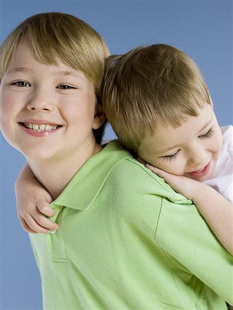 piggyback brothers - Boy giving boy piggyback ride Stock Photo - Premium Royalty-Free, Code: 640-01352280