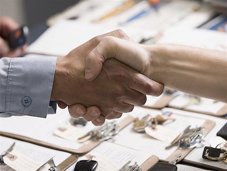 Close-up of two people shaking hands Stock Photo - Premium Royalty-Free, Code: 640-01352424