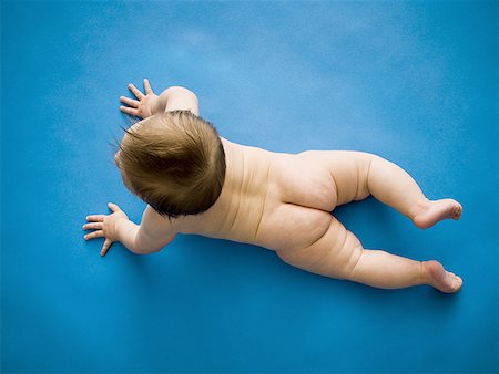 Baby on belly from above Stock Photo - Premium Royalty-Free, Code: 640-01352427